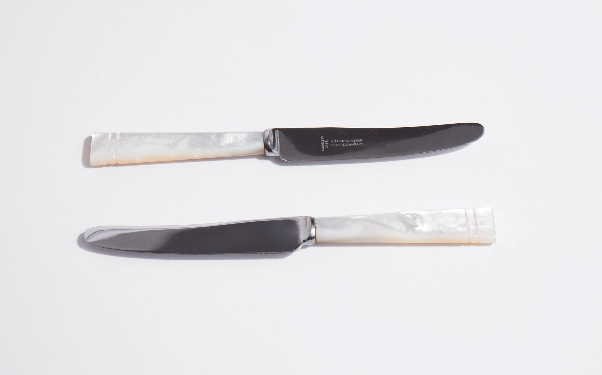 Stainless Steel Serrated Knives With Pearl Handle. Sheffield